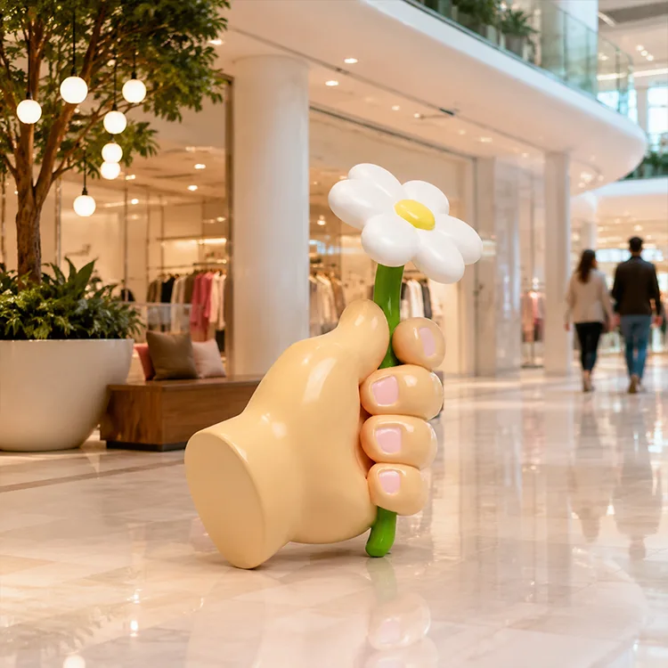 Hand Holding Flower Sculpture